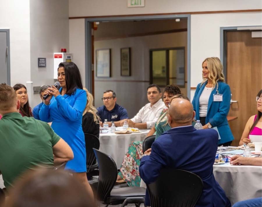 Professional woman speaking at a business workshop