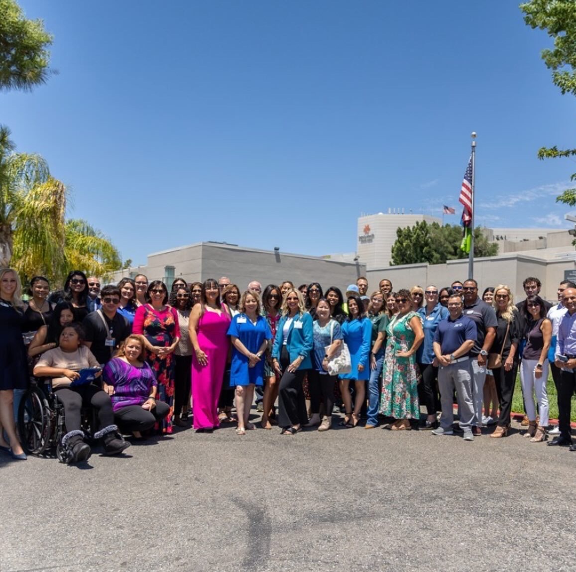 Large group of professionals at outdoor company event