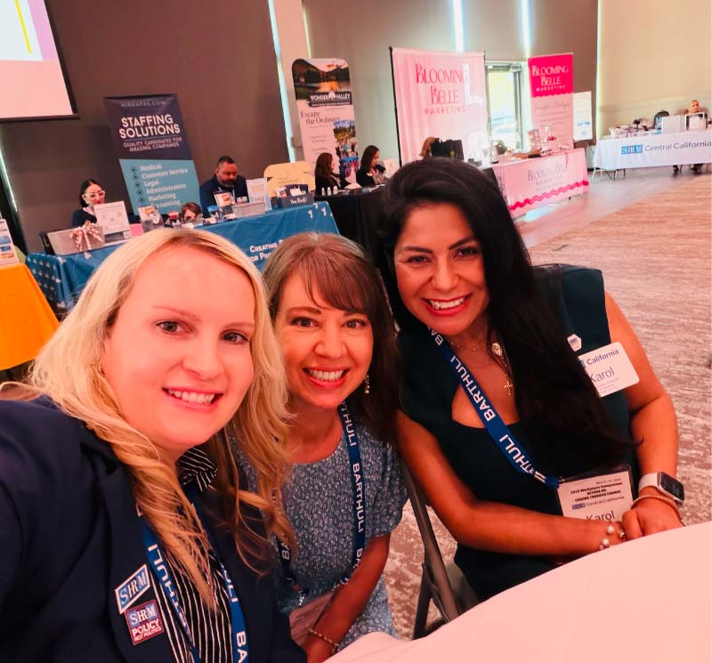 Three women at a business conference