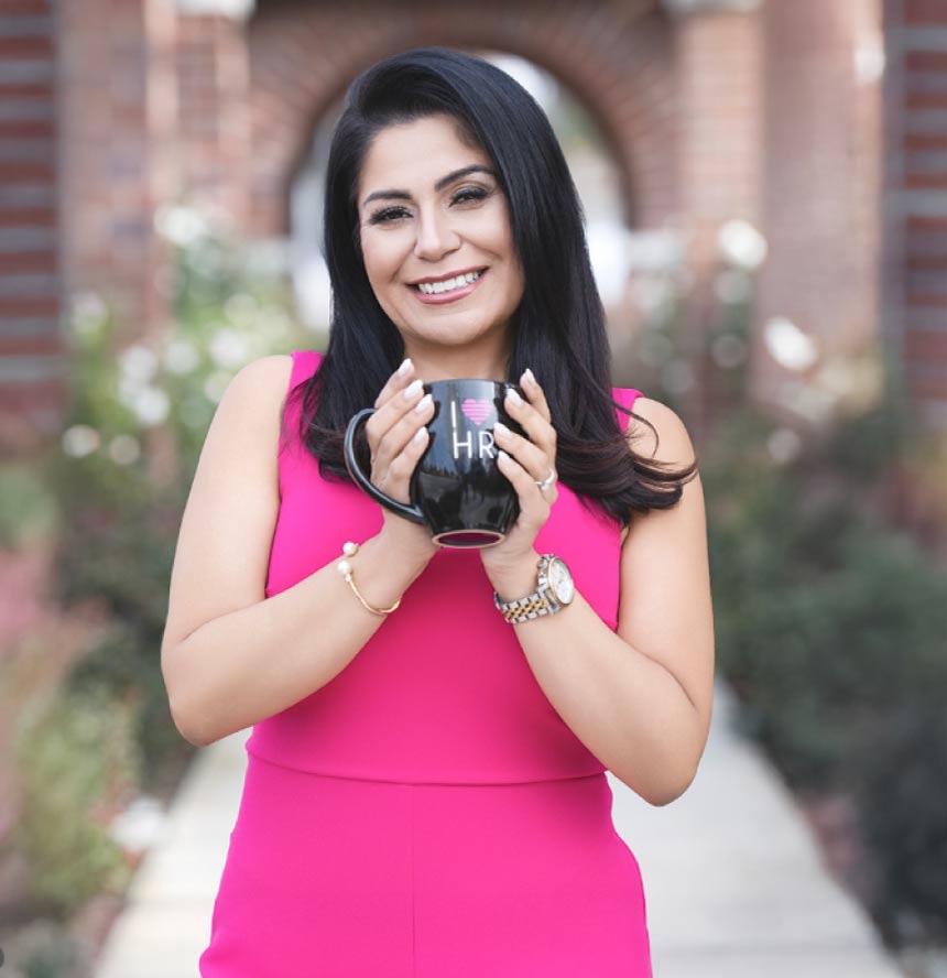 karol oxford with a mug saying I love HR
