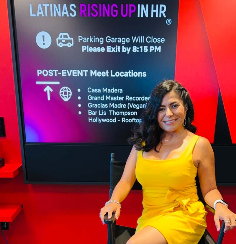 Karol Oxford at a 'Latinas Rising Up in HR' event, highlighting her commitment to community leadership and professional development within the human resources field.